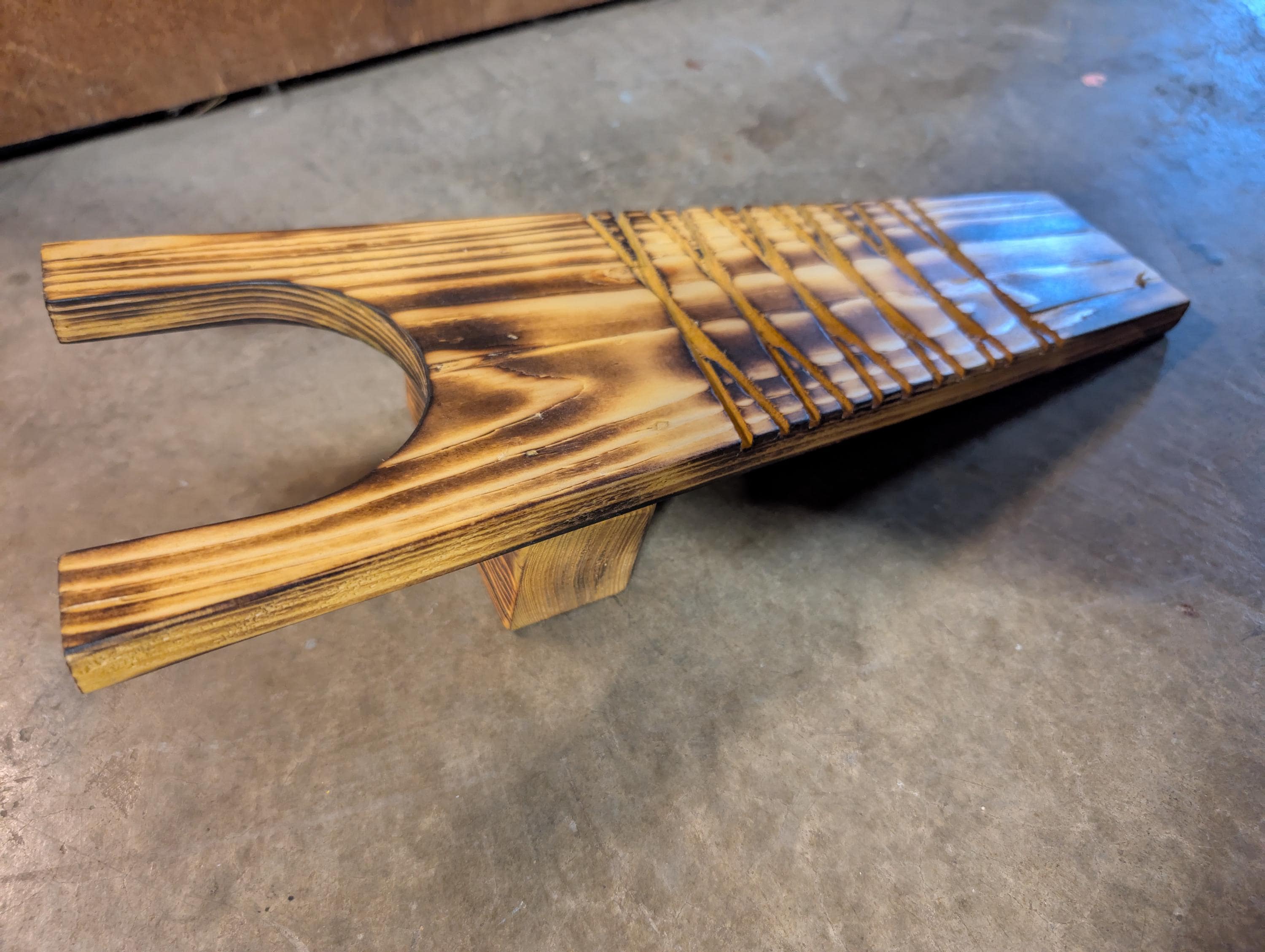 Rustic handcrafted boot jack. Hand crafted from natural wood, and stained to desire.
