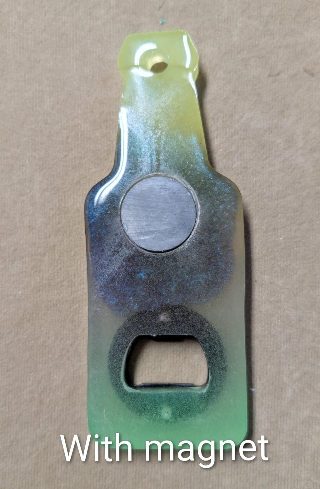 Bottle shaped bottle opener.  Many color options available with a magnet option on the back for hanging.