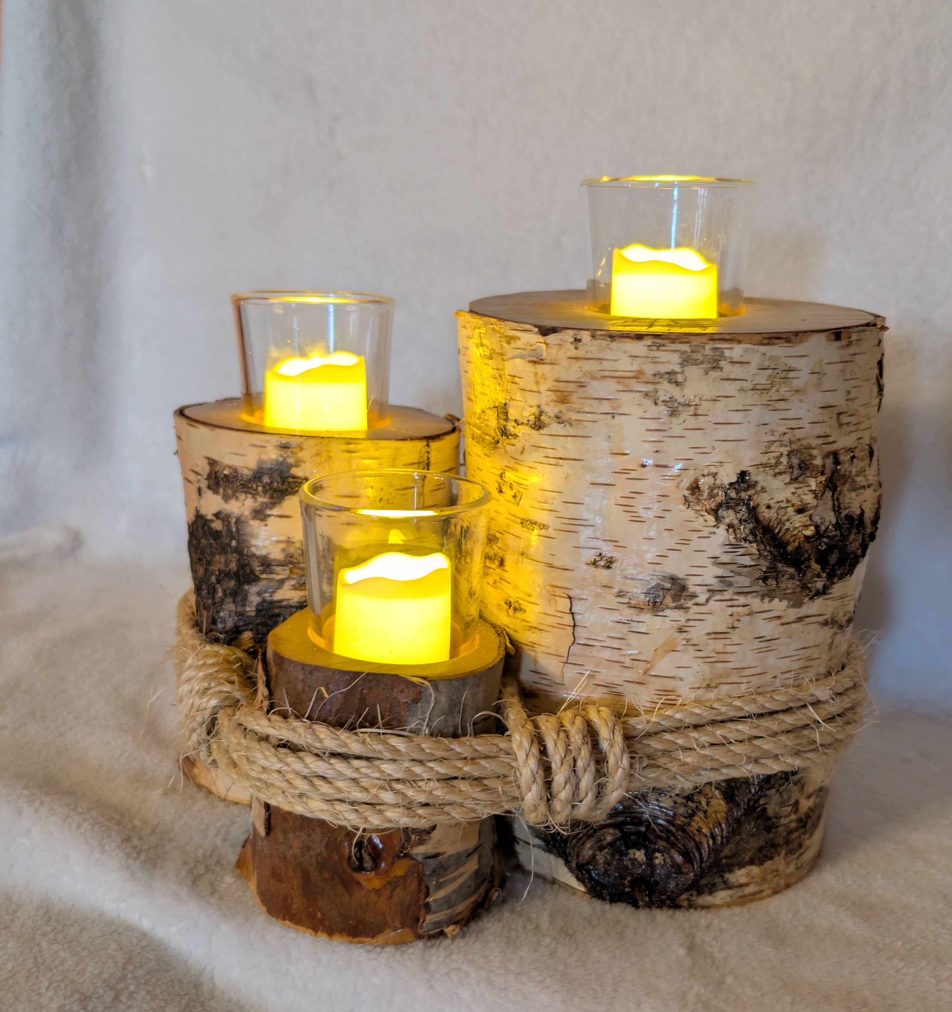 Hand crafted rustic farmhouse 3 tier log votive candle holder.
