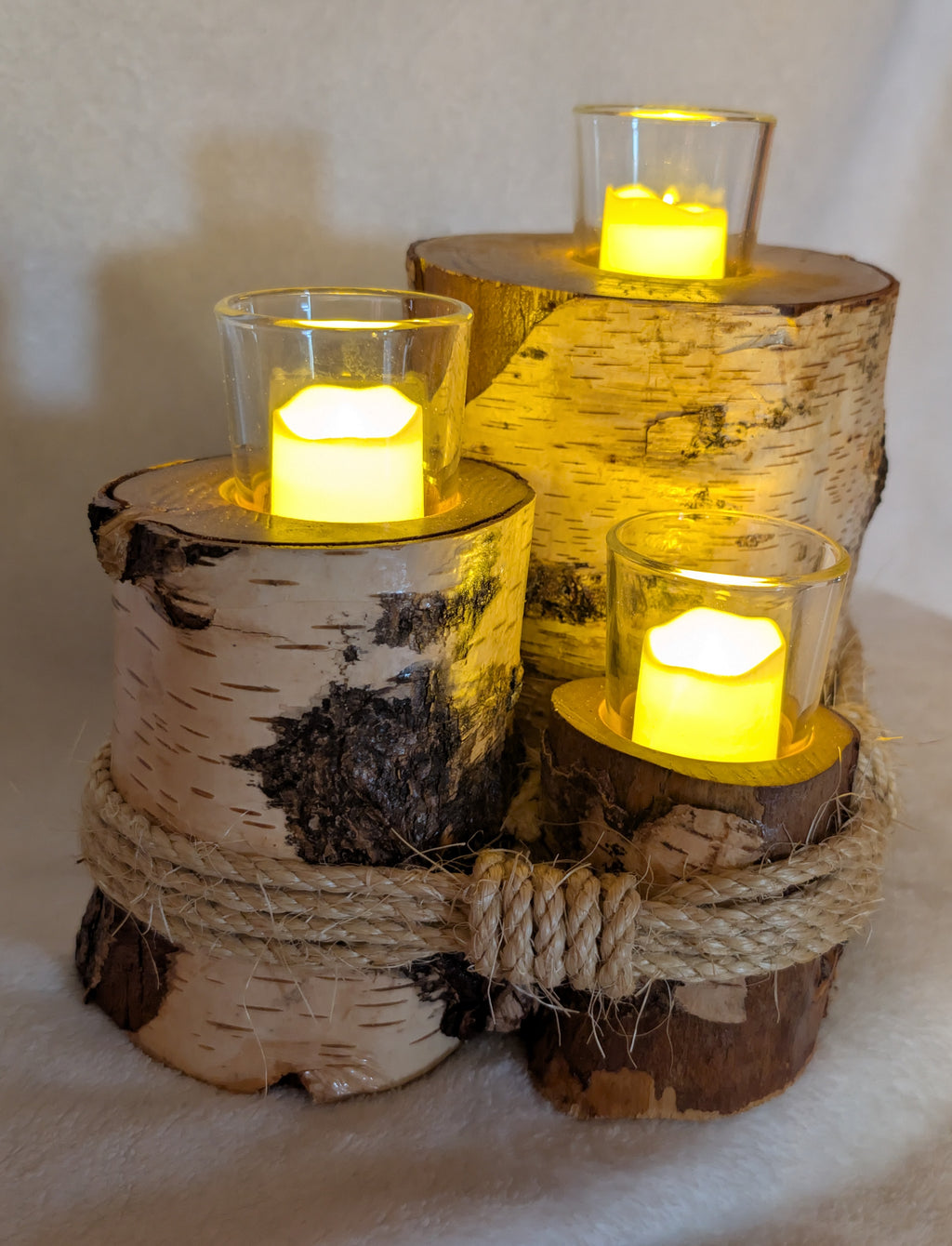 Hand crafted rustic farmhouse 3 tier log votive candle holder.
