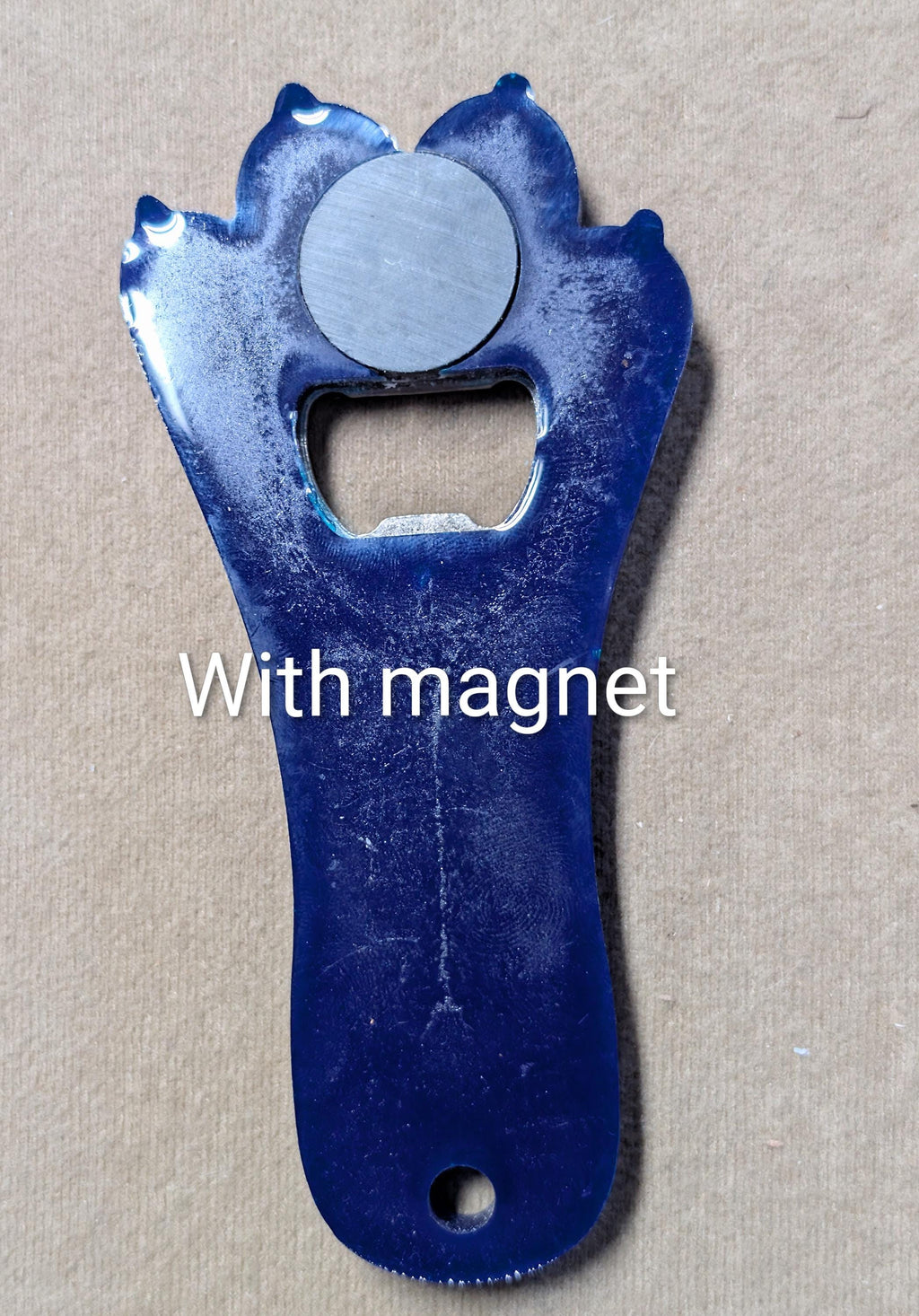 Paw print bottle openers many other colors available.  Also available with magnet on back.