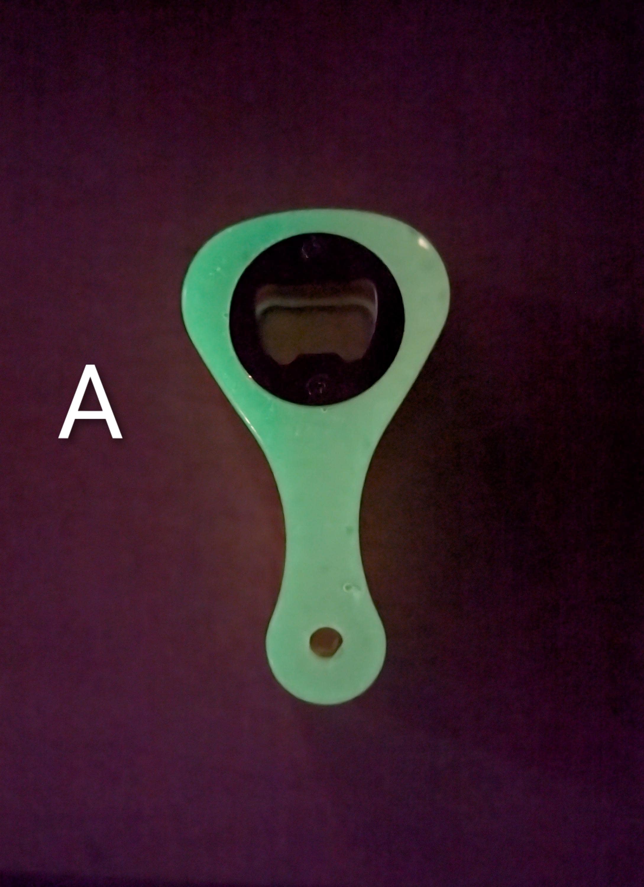 Paddle shaped bottle opener. Orange in color. Many other colors also available