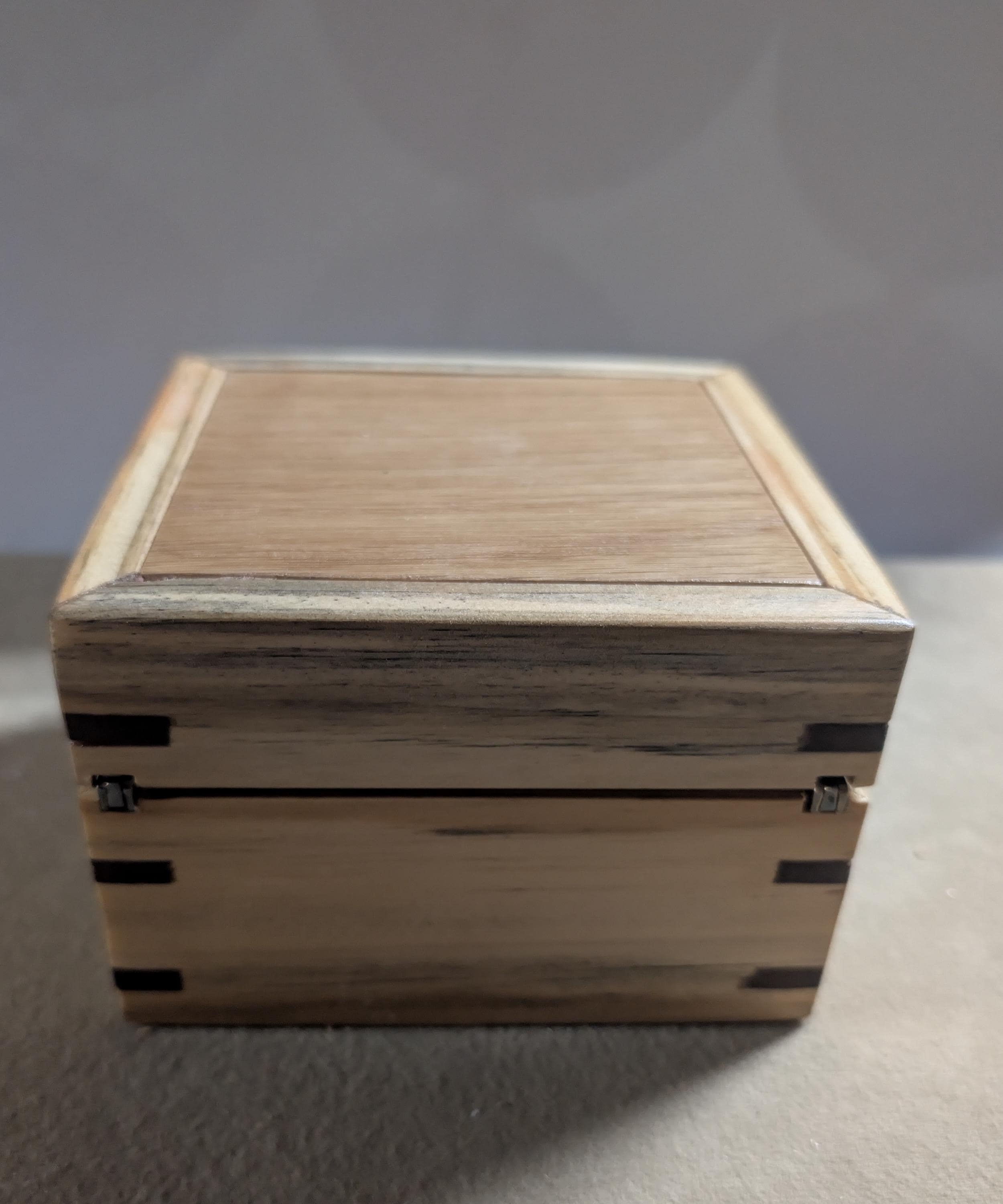 Hand crafted small jewelry or keepsake box.  poplar, oak, and walnut with red velvet Lining