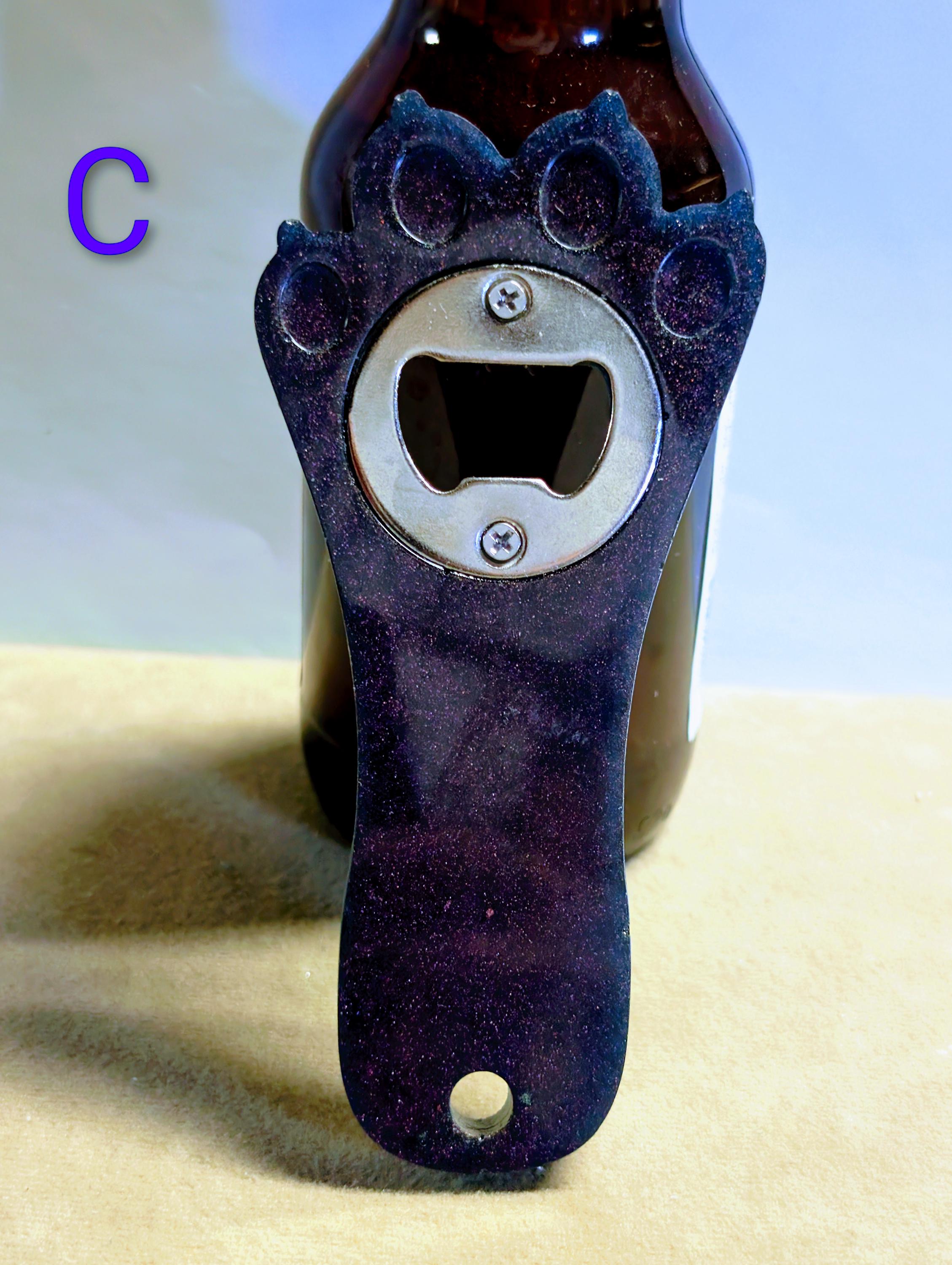 Paw print bottle openers many other colors available.  Also available with magnet on back.