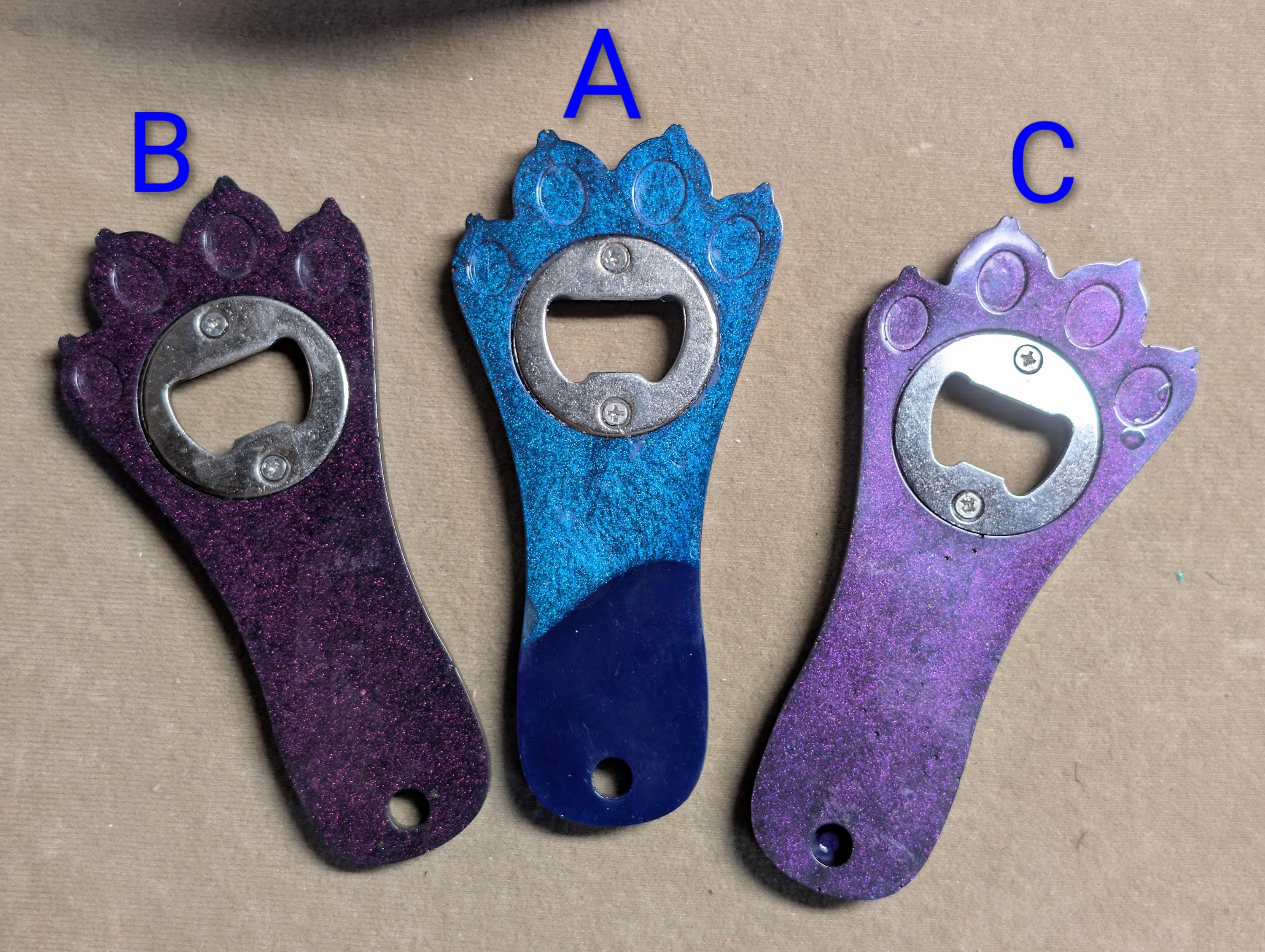 Paw print bottle openers many other colors available.  Also available with magnet on back.
