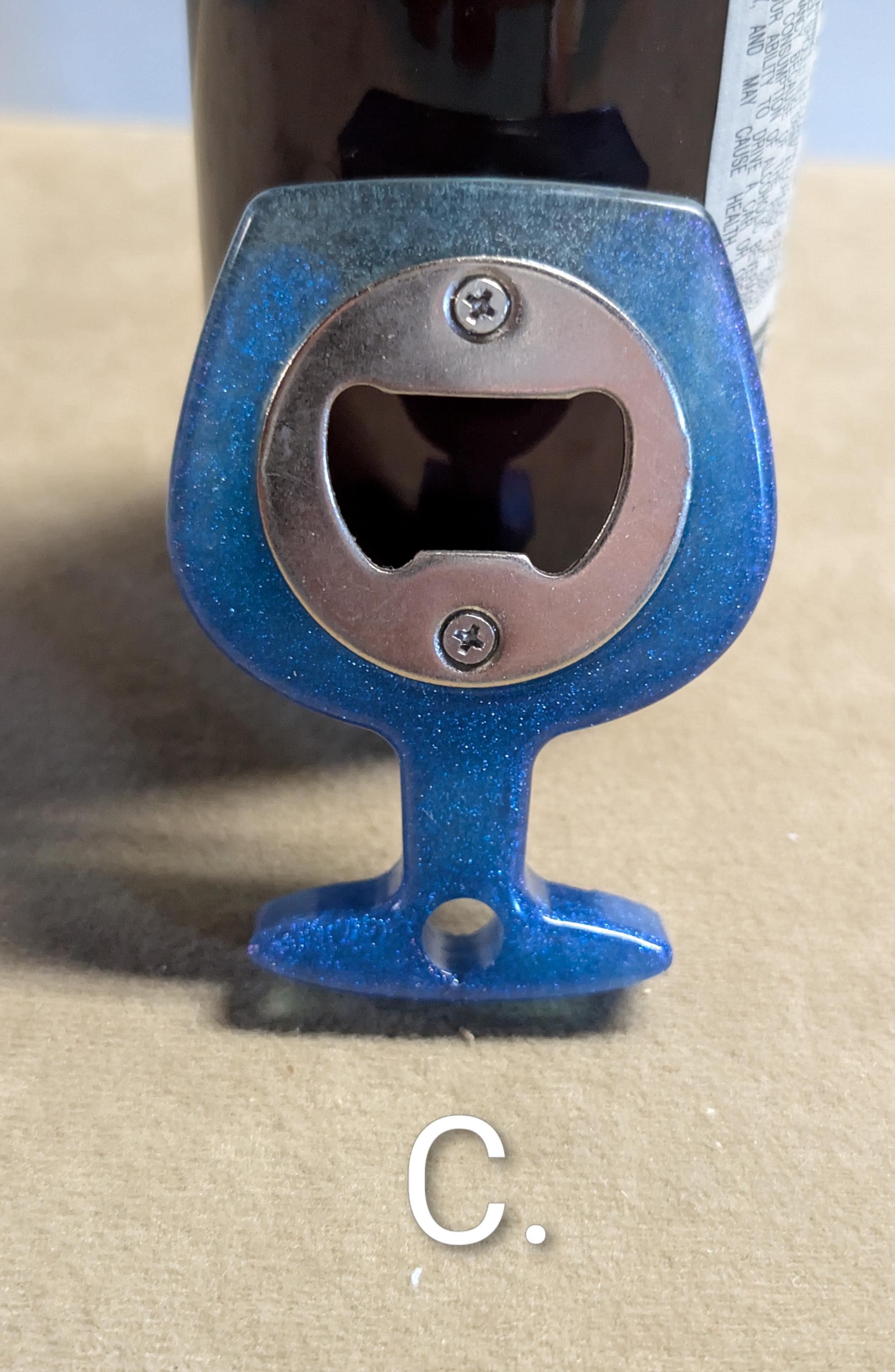 Wine glass shaped bottle opener. Many colors available.