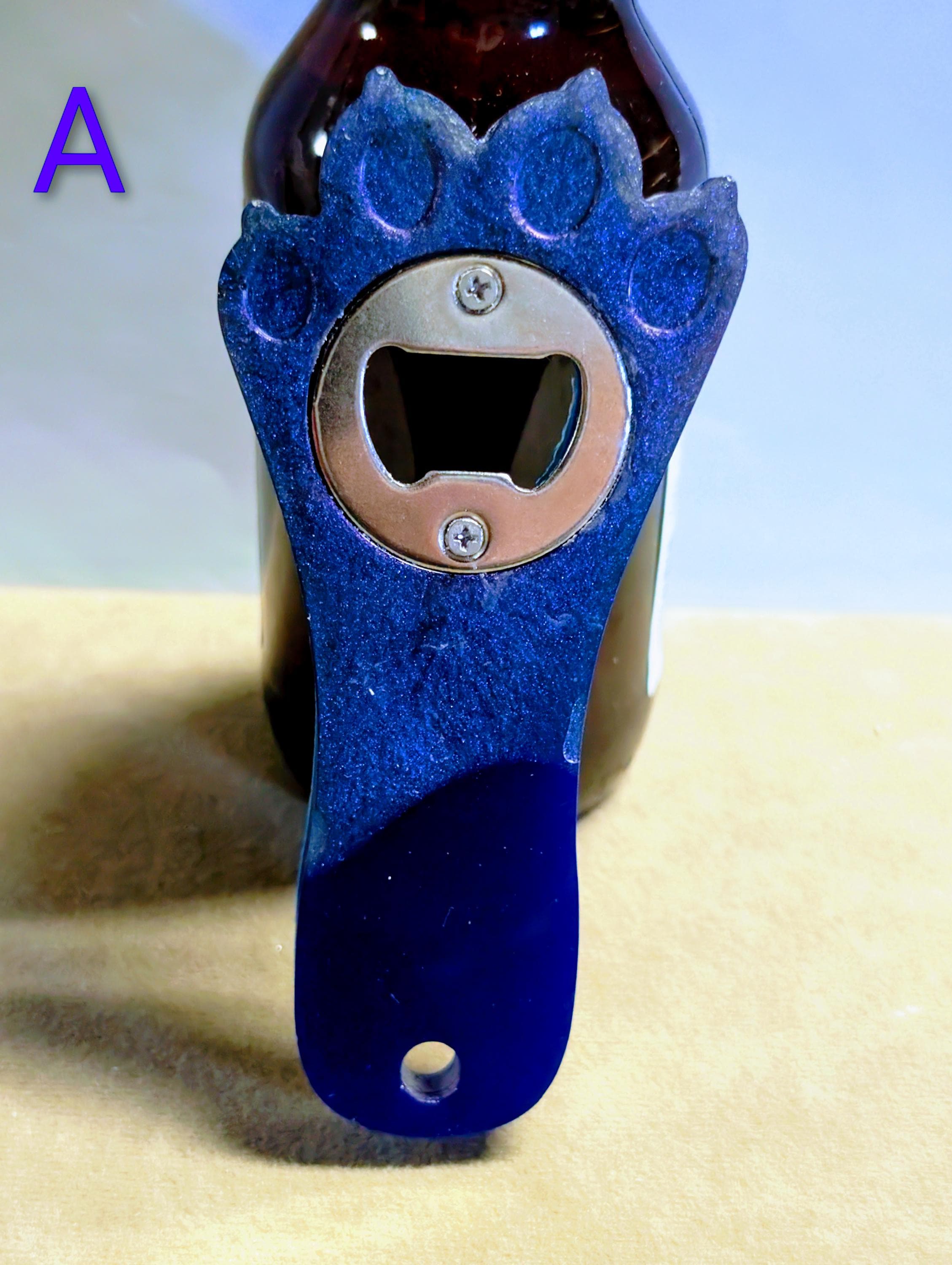 Paw print bottle openers many other colors available.  Also available with magnet on back.