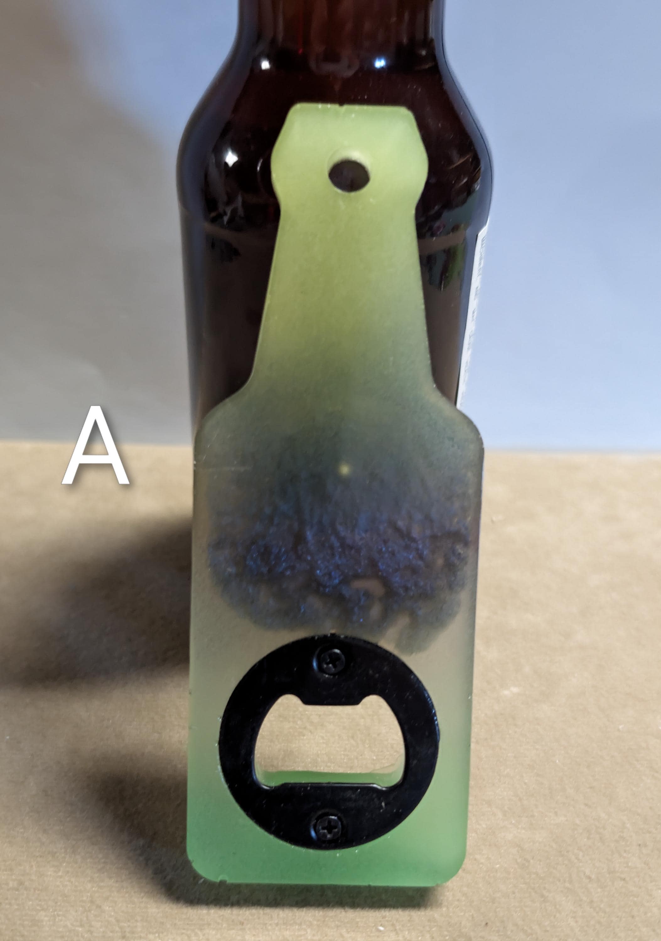 Bottle shaped bottle opener.  Many color options available with a magnet option on the back for hanging.