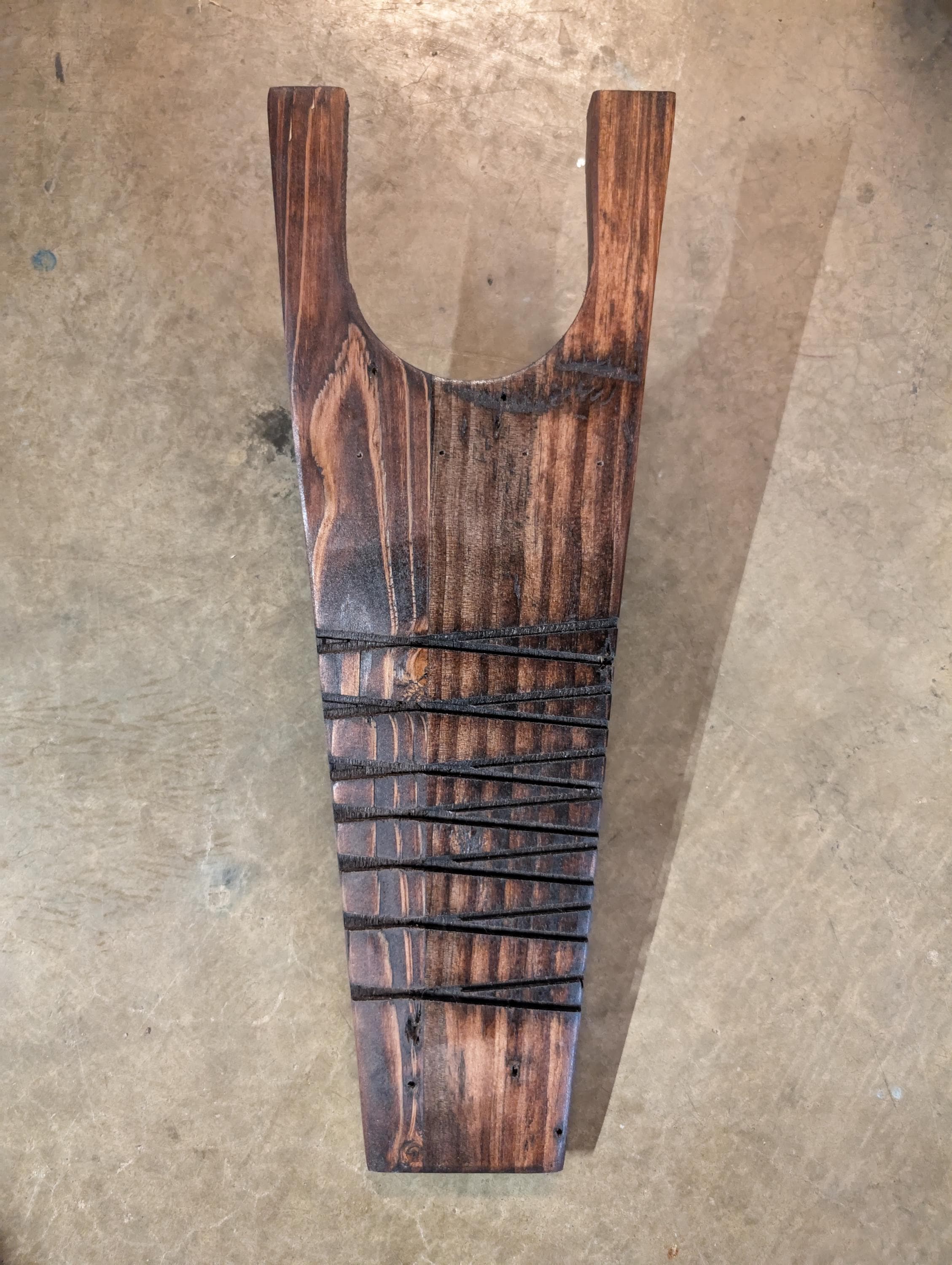 Rustic handcrafted boot jack. Hand crafted from natural wood, and stained to desire.